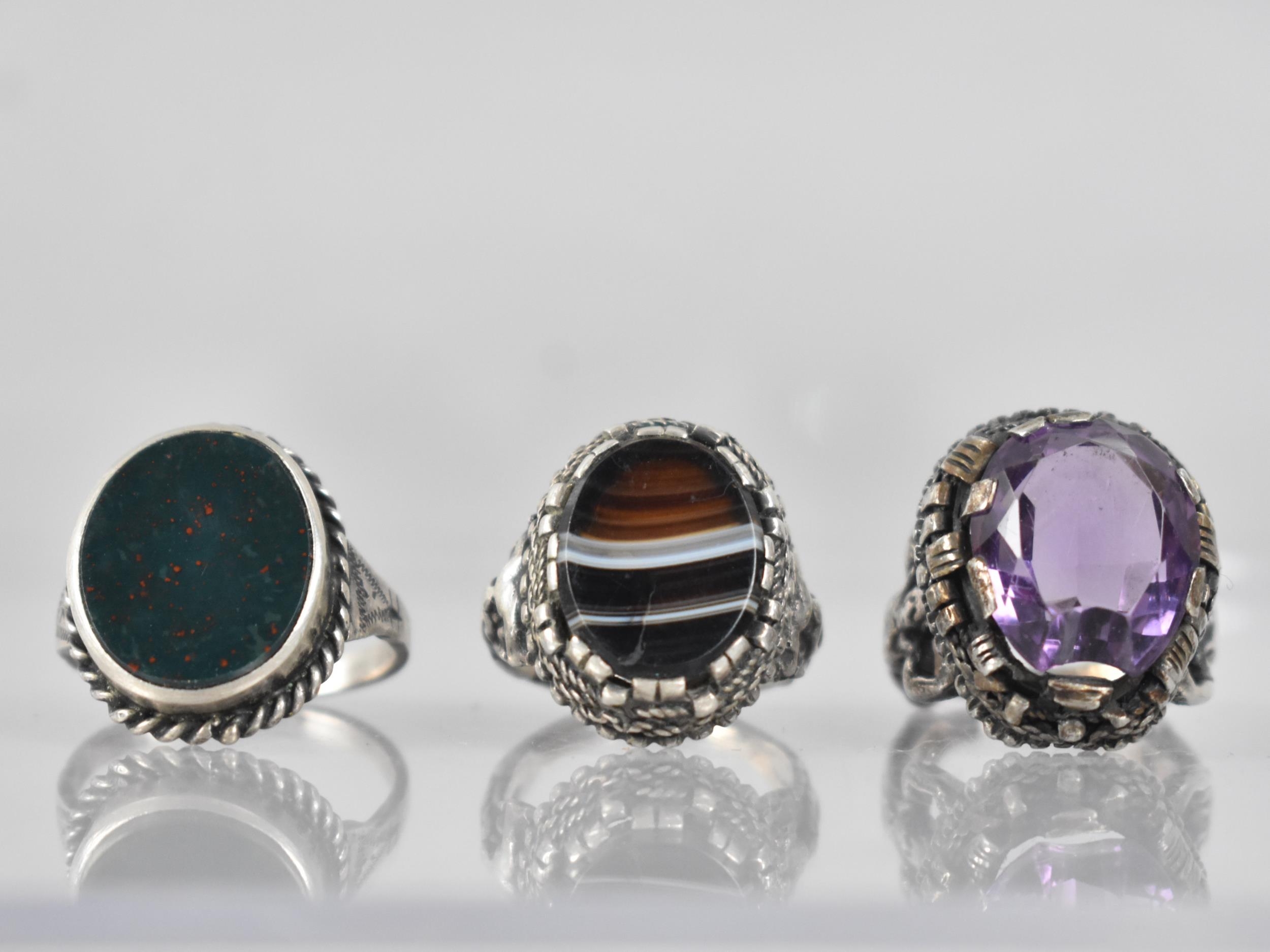 A Collection of Three Silver and White Metal Rings to include Unusual Continental Banded Agate