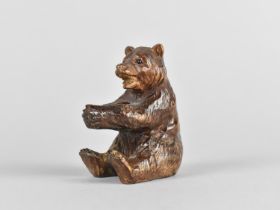 A Black Forest Carved Wooden Bear, Modelled Seated, 6cms High