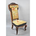 A Victorian Mahogany Framed Tapestry Upholstered Prie Dieu, the Back of T Shaped Form with Carved