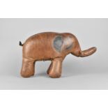 A Small Vintage Brown Stitched Leather Covered Footstool in the Form of an Elephant, in the Manner
