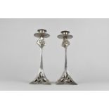 A Pair of Arts and Crafts Style Silver Plated Candlesticks with Flared Square Pierced Bases having