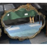 An Ornate Framed Mirror with Moulded Scrolls and Foliage Decoration