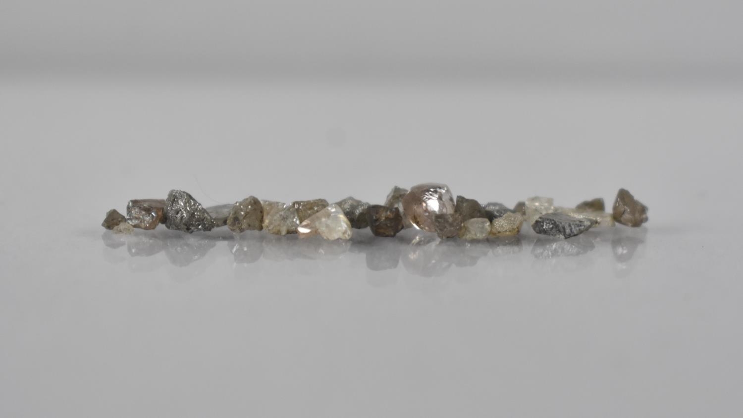 A Collection of Small Uncut Diamonds, Approximately 1gms Total