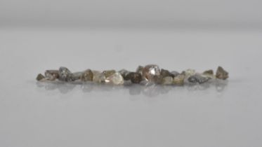 A Collection of Small Uncut Diamonds, Approximately 1gms Total