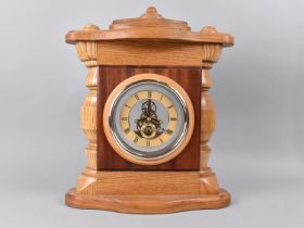 An Oak Cased Mantel Clock with Skeleton Battery Movement