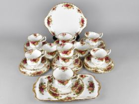 A Royal Albert Tea Set to Comprise Ten Cups, Nine Saucers, Seven Saucers, Cake Plate and a