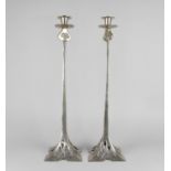 A Pair of Arts and Crafts Style Silver Plated Candlesticks with Flared Square Pierced Bases having