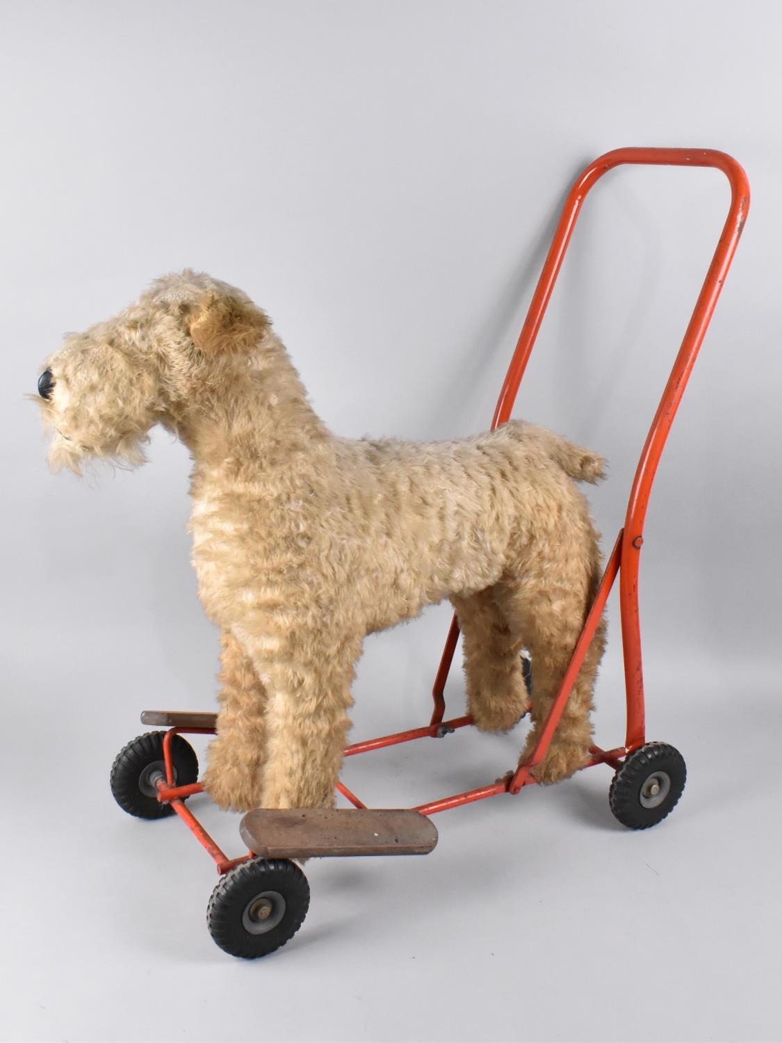 A Vintage Lines Bros of Ireland Push Along Terrier Dog with Steel Frame and Rubber Tyres, Makers