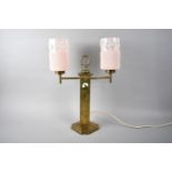 A Brass Two Branch Table Lamp with Pink Glass Cylindrical Shade, 47cms High
