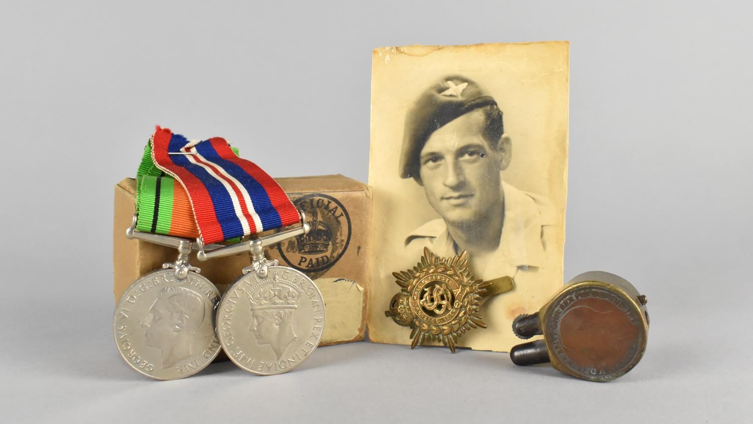 Two WWII Medals, Defence and War Medal, in Box for H. Humphries, together with Photograph, Cap Badge