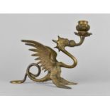 An Ornate Brass Candlestick Modelled as a Winged Griffin, 16cms High