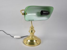 A Brass Desk Lamp with Green Glass Shade