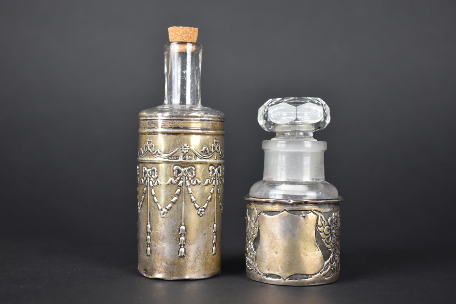 Two Silver Mounted Glass Bottles, the Taller Example with Bow and Swag Decoration by S&Co.,