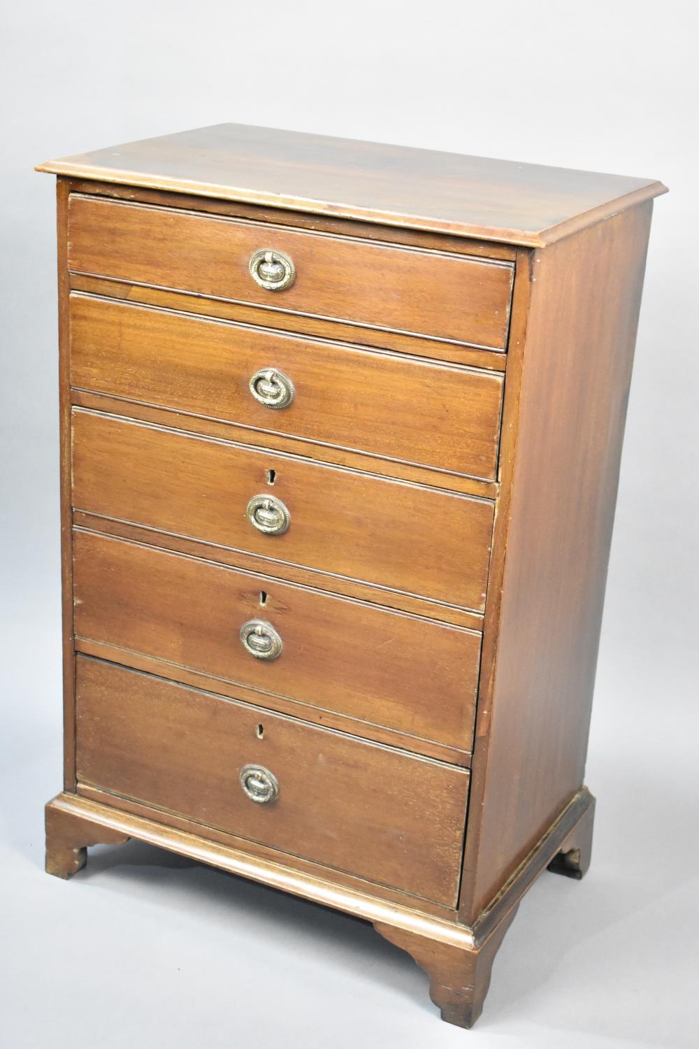 A Mahogany Chest of Five Short Drawers on Bracket Feet having Drop Cast Handles with Urn Motif,