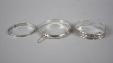 Three Silver Bracelets to include Childs Bangle, Eastern Cuff and Vintaged Hinged Bangle with