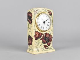 A Moorcroft Mantle Clock, Chocolate Cosmo Pattern, 2013, 15cm high, with Box