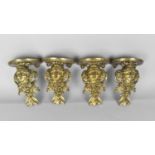 A Set of Four Cast Brass Wall Sconces Modelled with Maidens Head Amongst Foliage and Acanthus