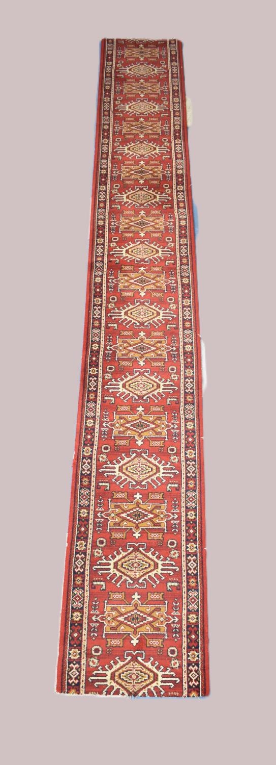 A Patterned Runner or Stair Carpet on Red Ground, 387x52cms Approx, Cut