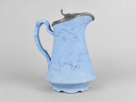 A 19th Century Cobridge Relief Jug Decorated with Hunting Scene having Pewter Lid, 21cm High