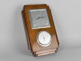 An Edwardian Oak Cased Aneroid Barometer