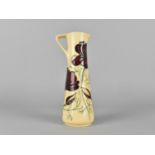 A Moorcroft Ewer Jug, Chocolate Cosmo Pattern, 18.5cm high