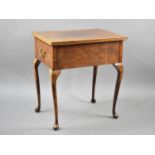 A Mahogany Side Work Table with Lift Top on Cabriole Supports having Twin Brass Drop Handles, 59.