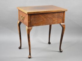 A Mahogany Side Work Table with Lift Top on Cabriole Supports having Twin Brass Drop Handles, 59.