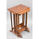 A Mahogany String Inlaid Nest of Three Tables, the Tops with Central Inlaid Fan Decoration, 41x61cms