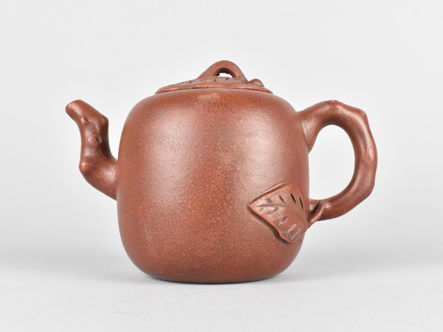 A Chinese Yixing Teapot, Stylised Spout and Handle with Incised Inscription and Sealmark to Base,