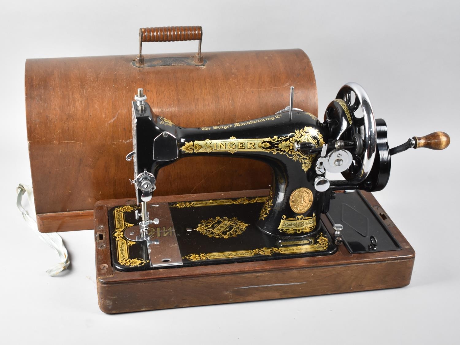 A Manual Singer Sewing Machine In Case