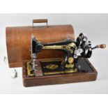 A Manual Singer Sewing Machine In Case