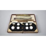 A Cased Set of Mother of Pearl Gentleman's Studs together with Three Propelling Pencils, Mother of