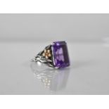 An 18ct Gold Mounted Silver and Emerald Cut Amethyst Type Stone Ring, Floral Mounted Shoulders, Band