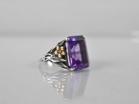 An 18ct Gold Mounted Silver and Emerald Cut Amethyst Type Stone Ring, Floral Mounted Shoulders, Band