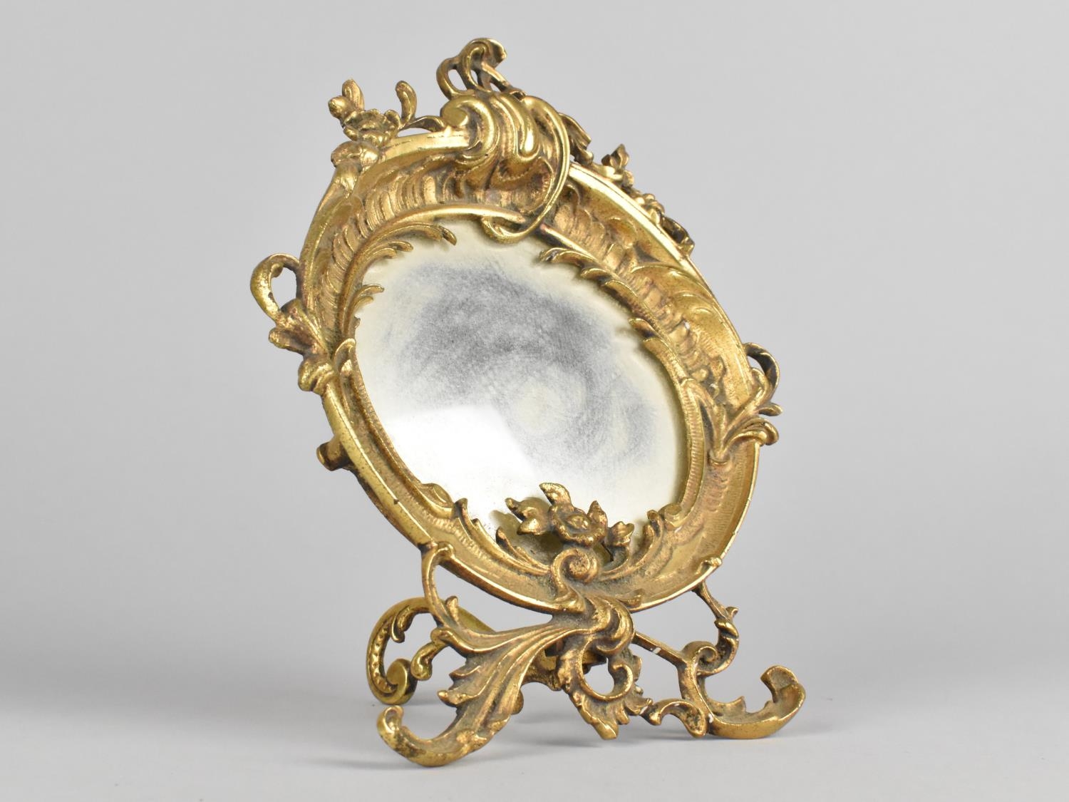A Small Ornate Cast Brass Dressing Table Mirror of Circular Form with Floral and Scrolled
