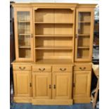 A Modern Light Oak Breakfront Dresser, the Base with Four Drawers Over Cupboards, Raised Central