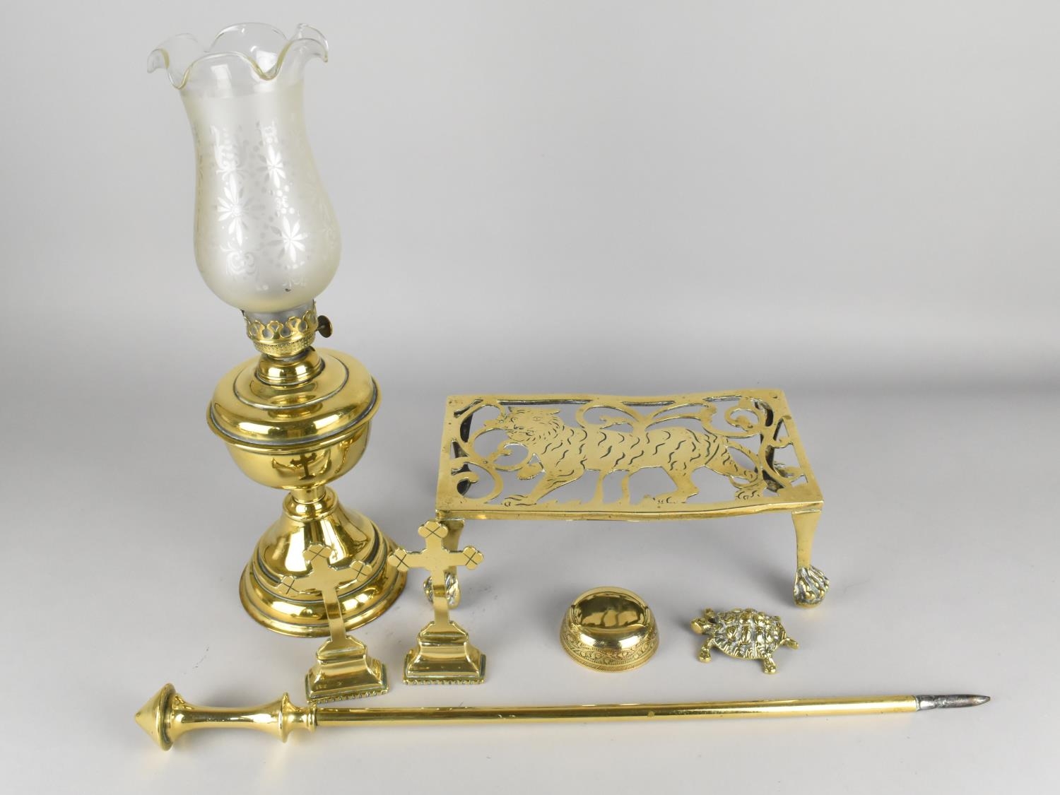 A Collection of Various Brass to Comprise Oil Lamp, Trivet Stand with Tiger Motif, etc