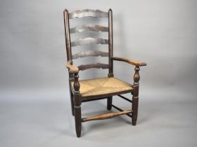 A 19th Century Oak Framed Rush Seated Armchair