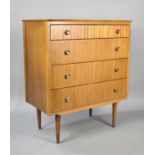 A Mid 20th Century Bedroom Four Drawer Chest, Raised on Tapering Supports. 79cms Wide