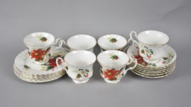 A Royal Albert Poinsettia Tea Set for Six to Comprise Cups, Saucers and Side Plates (Some
