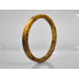 A Mottled Orange, Brown and Green Bakelite Bangle, 11.8gms, 77mm Diameter External Dimension, 64mm