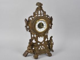 An Ornate Cast and Pierced Brass Clock, 36cms High