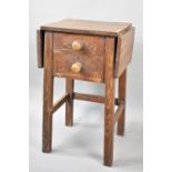 An Early/Mid 20th Century Stained Pine Scumble Glazed Style Drop Leaf Work Table with one Long and