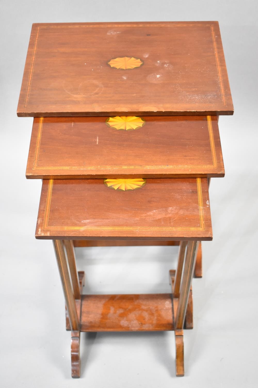 A Mahogany String Inlaid Nest of Three Tables, the Tops with Central Inlaid Fan Decoration, 41x61cms - Image 2 of 2