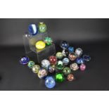 A Collection of Twenty-Eight Various Glass Paperweights to Include Examples by Mdina etc