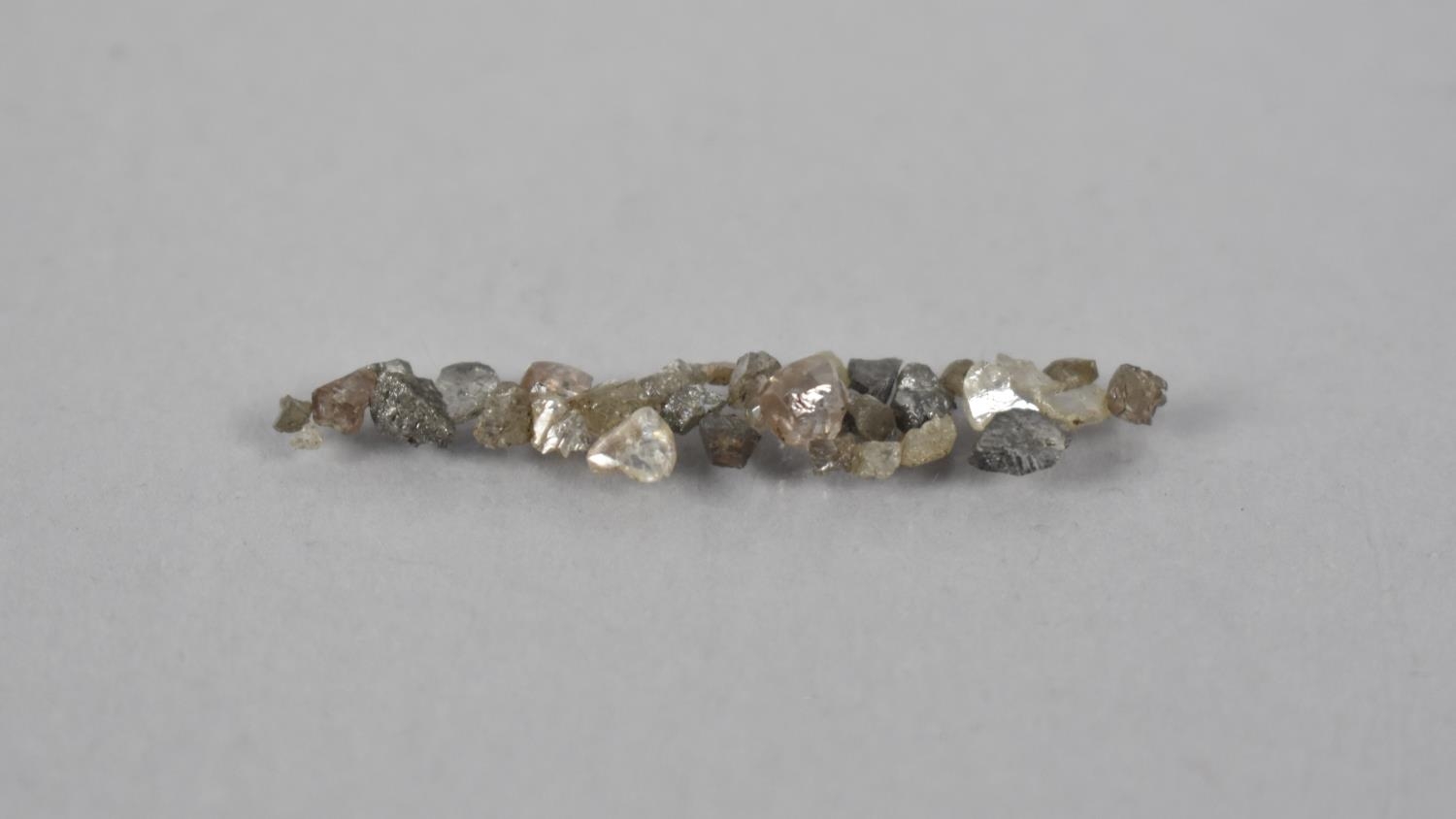 A Collection of Small Uncut Diamonds, Approximately 1gms Total - Image 2 of 2