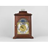 A Franz Hermle Mahogany Cased Bracket Clock of Architectural Form with Foliate Brass Square Face