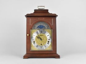 A Franz Hermle Mahogany Cased Bracket Clock of Architectural Form with Foliate Brass Square Face