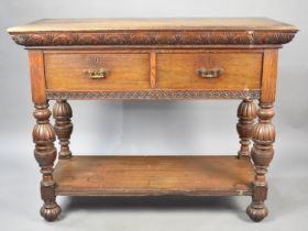 An Oak Side Table or Buffet Having Two Short Drawers on Folded Supports with Stretcher Shelf and