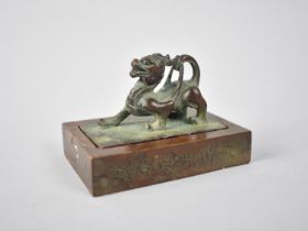 A Chinese Bronze Double Seal, Modelled with Mythical Qilin, 8x6x6cms High